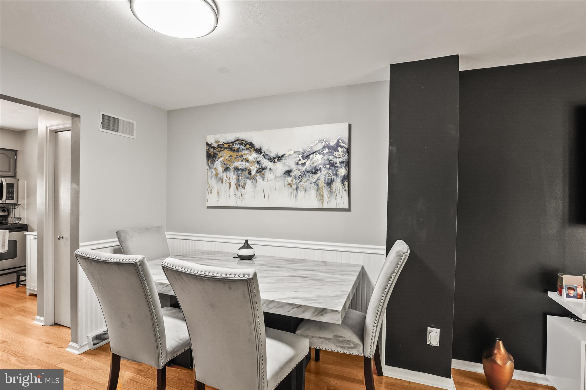 451 Weldon Drive, Unit 451 York, PA 17404 - Photo 10 of 38 a view of a dining room with furniture and wooden floor