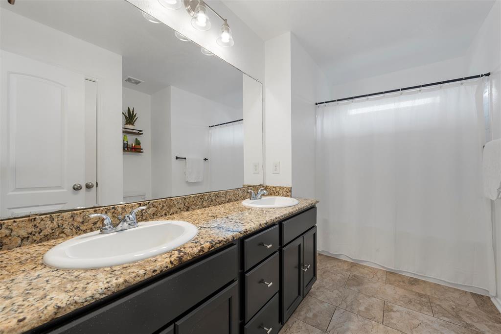 4321 South Fork Ranch Road Waco, TX 76705 - Photo 8 of 17 a bathroom with a granite countertop sink and a mirror