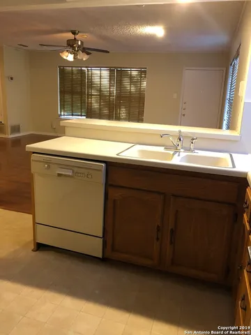 a bathroom with a sink and a large mirror