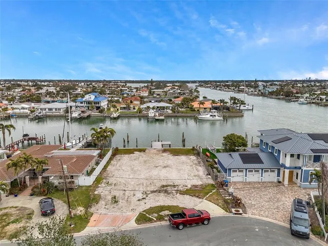 an aerial view of a house with outdoor space