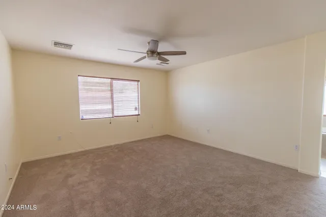 a view of a bathroom from a hallway