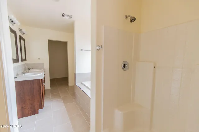 a bathroom with a bathtub and a sink
