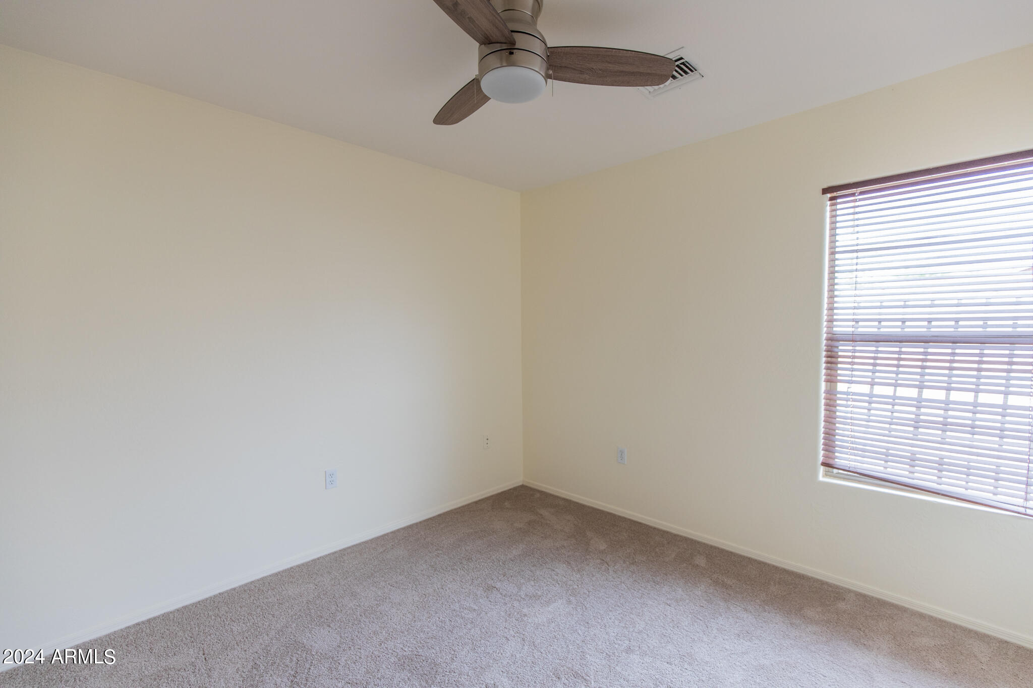 9013 North 14th Street Phoenix, AZ 85020 - Photo 18 of 24 a view of an empty room with a window