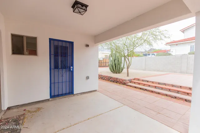 a view of a backyard with large trees