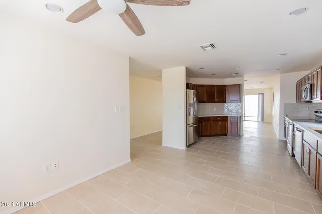 a view of kitchen and kitchen with sink