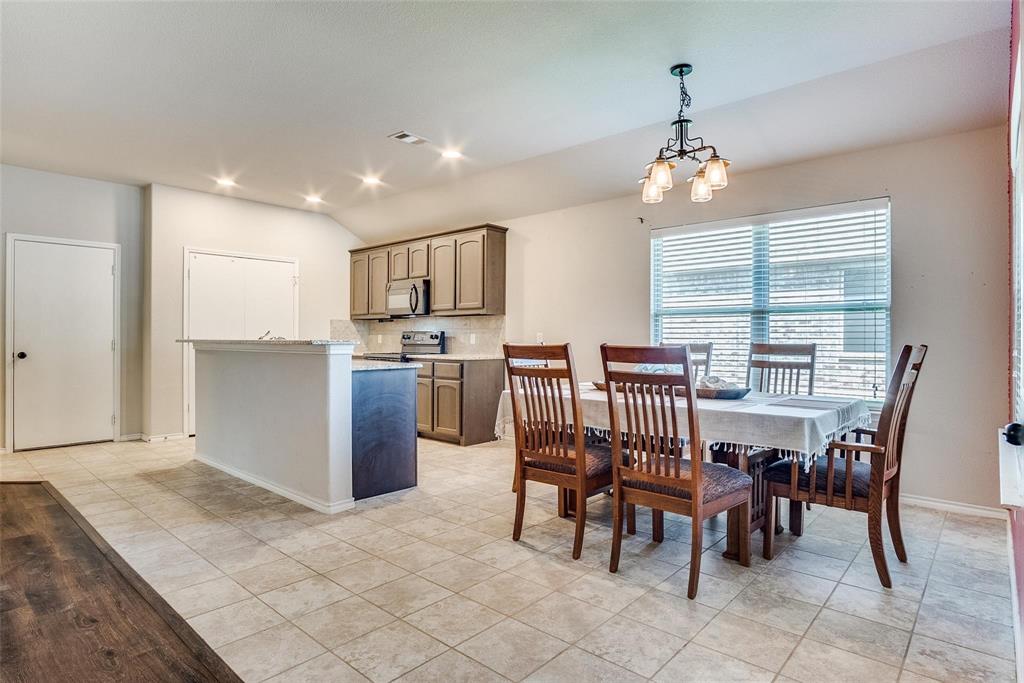 227 Walnut Bend Road Springtown, TX 76082 - Photo 11 of 31 a view of a dining room with furniture