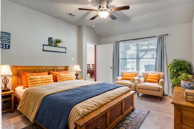 a bedroom with a balcony a bed and a couch