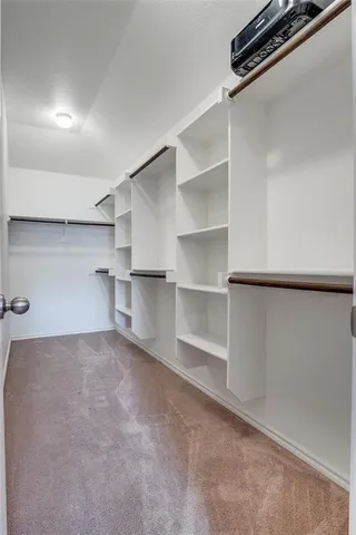 a view of a room with shelf on the wall