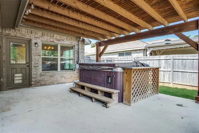 a view of a swimming pool with a patio