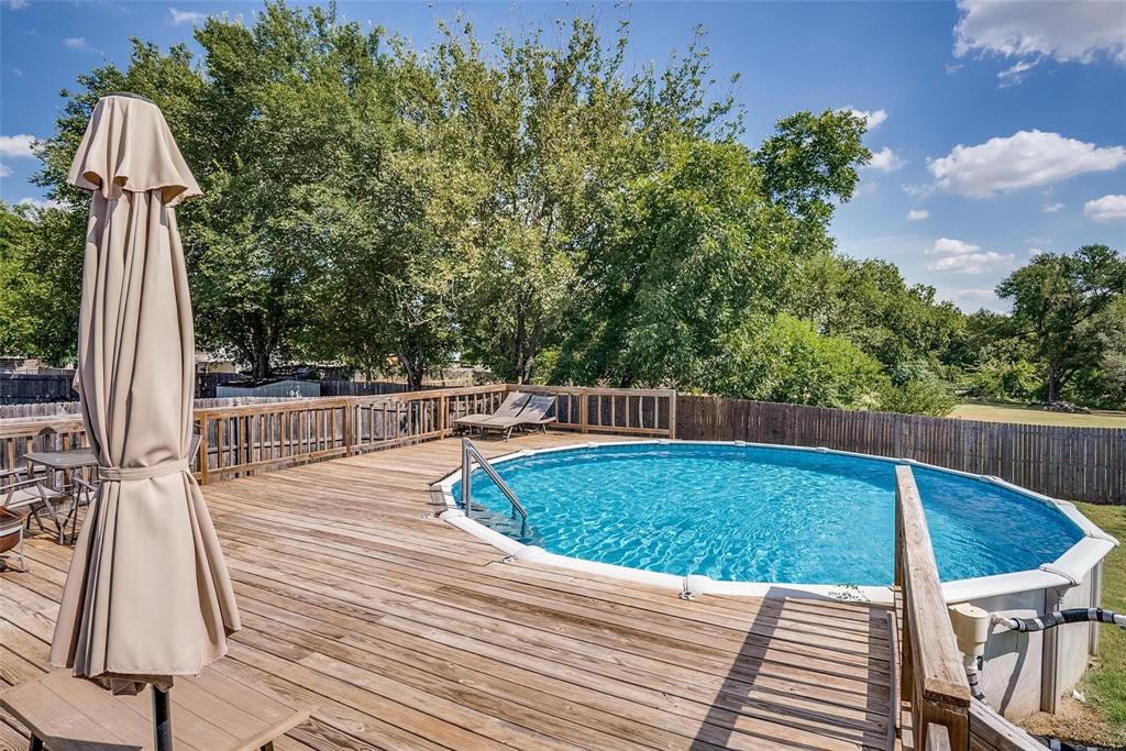 227 Walnut Bend Road Springtown, TX 76082 - Photo 25 of 31 a view of a swimming pool with a patio
