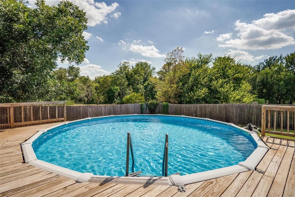 227 Walnut Bend Road Springtown, TX 76082 - Photo 26 of 31 a view of a backyard with wooden floor