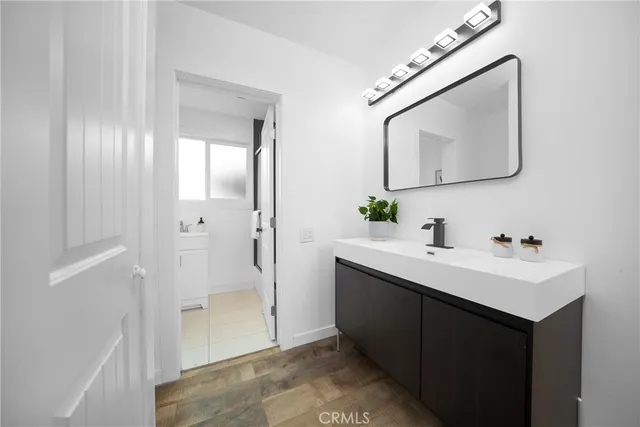 a en suite bathroom with a toilet sink and mirror
