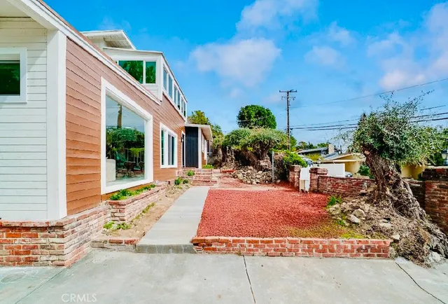 a view of house with outdoor space and sitting space