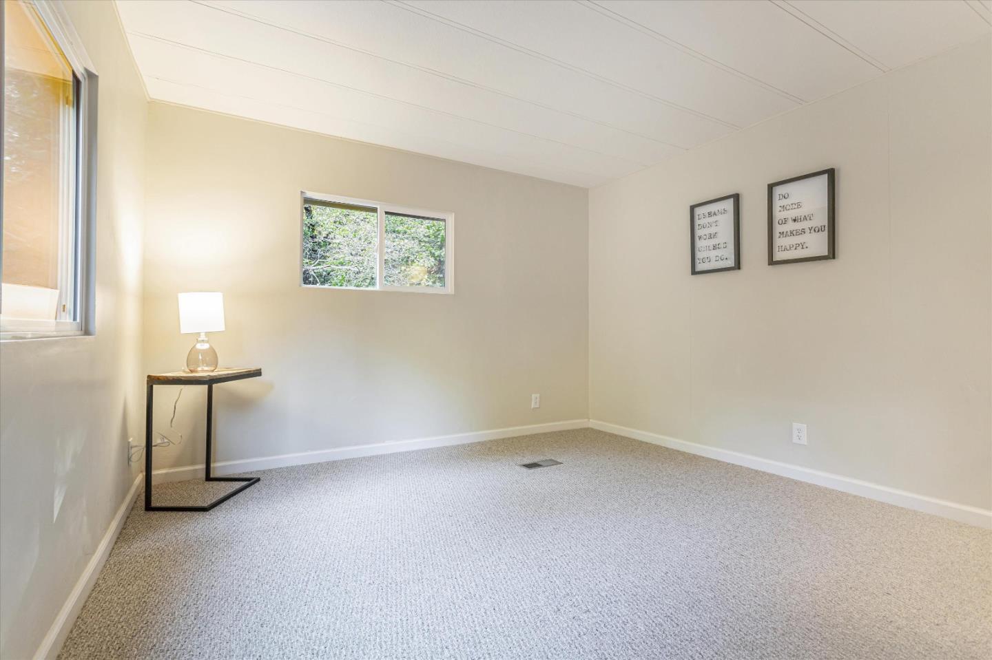 265 Brown Gables Road, Unit 34 Ben Lomond, CA 95005 - Photo 12 of 33 an empty room with windows