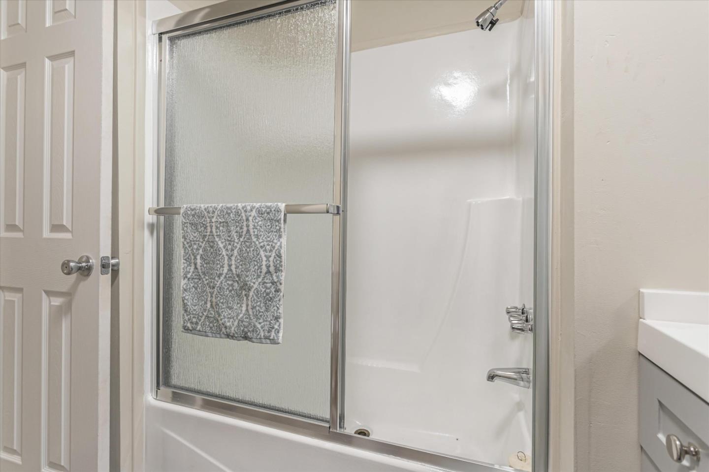 265 Brown Gables Road, Unit 34 Ben Lomond, CA 95005 - Photo 17 of 33 a bathroom with a glass shower door