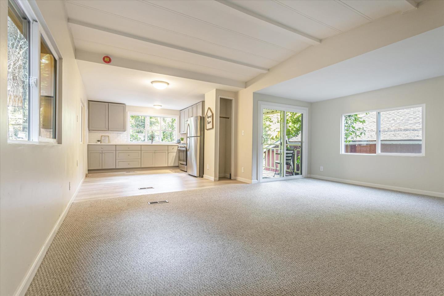 265 Brown Gables Road, Unit 34 Ben Lomond, CA 95005 - Photo 2 of 33 a view of a big room with windows and chandelier fan