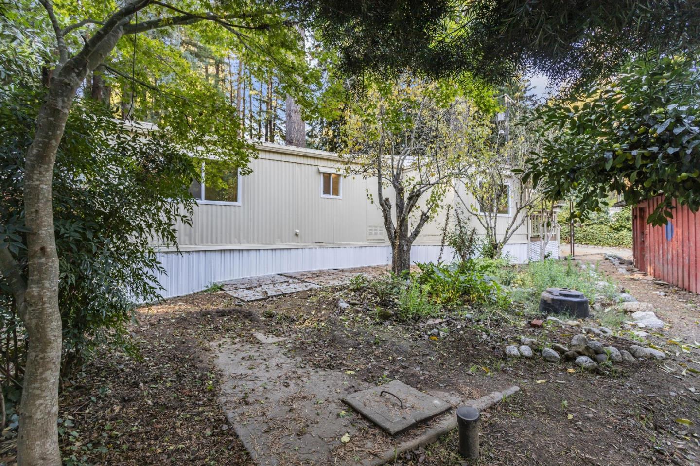 265 Brown Gables Road, Unit 34 Ben Lomond, CA 95005 - Photo 25 of 33 a view of a backyard with plants and large trees