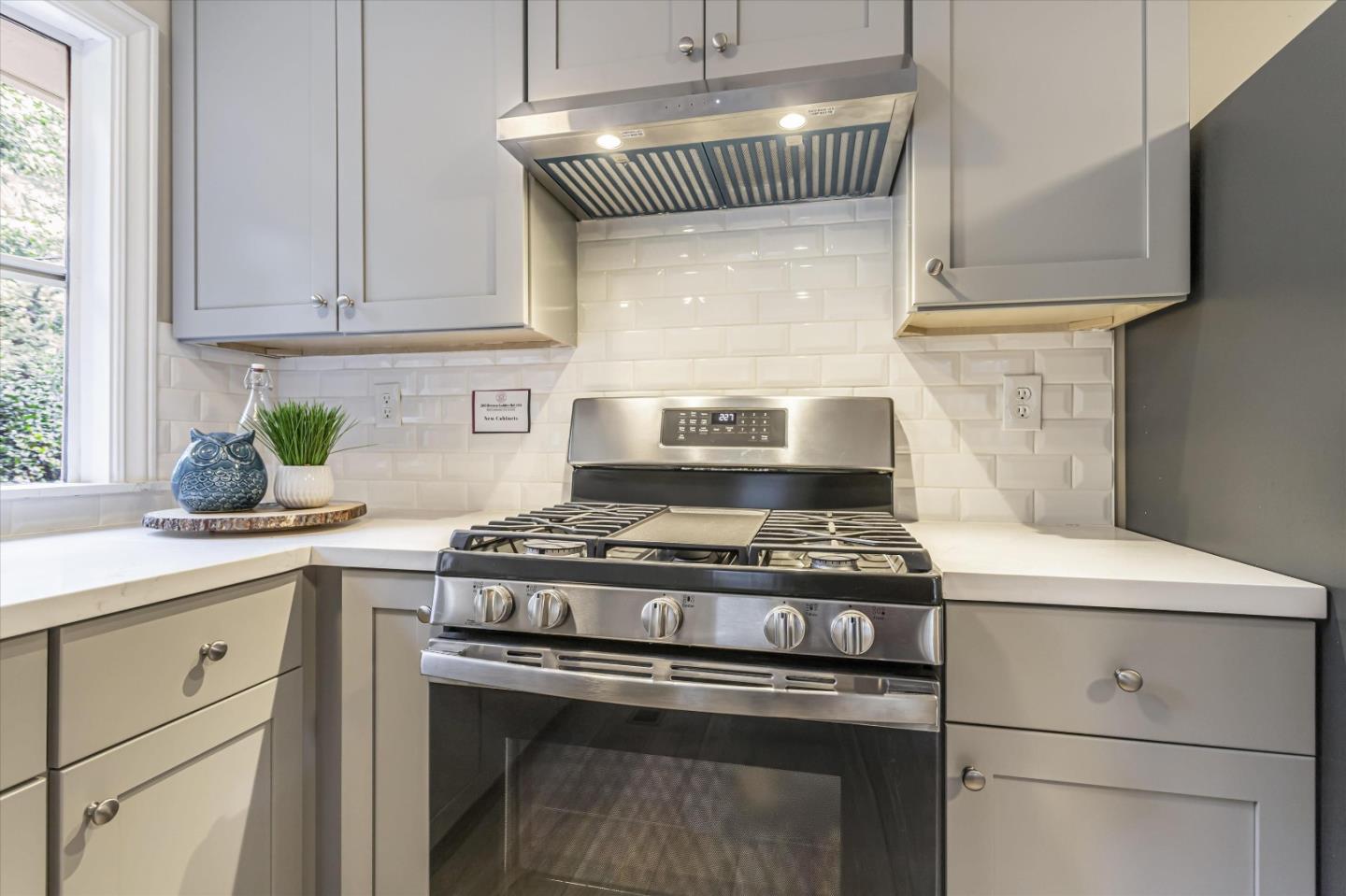 265 Brown Gables Road, Unit 34 Ben Lomond, CA 95005 - Photo 7 of 33 a kitchen with a stove and white cabinets