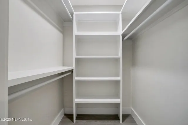 a view of an empty walk in closet