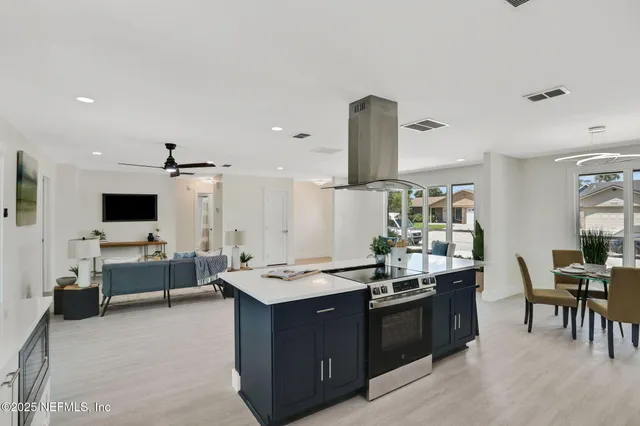 a living room with furniture and flat screen tv