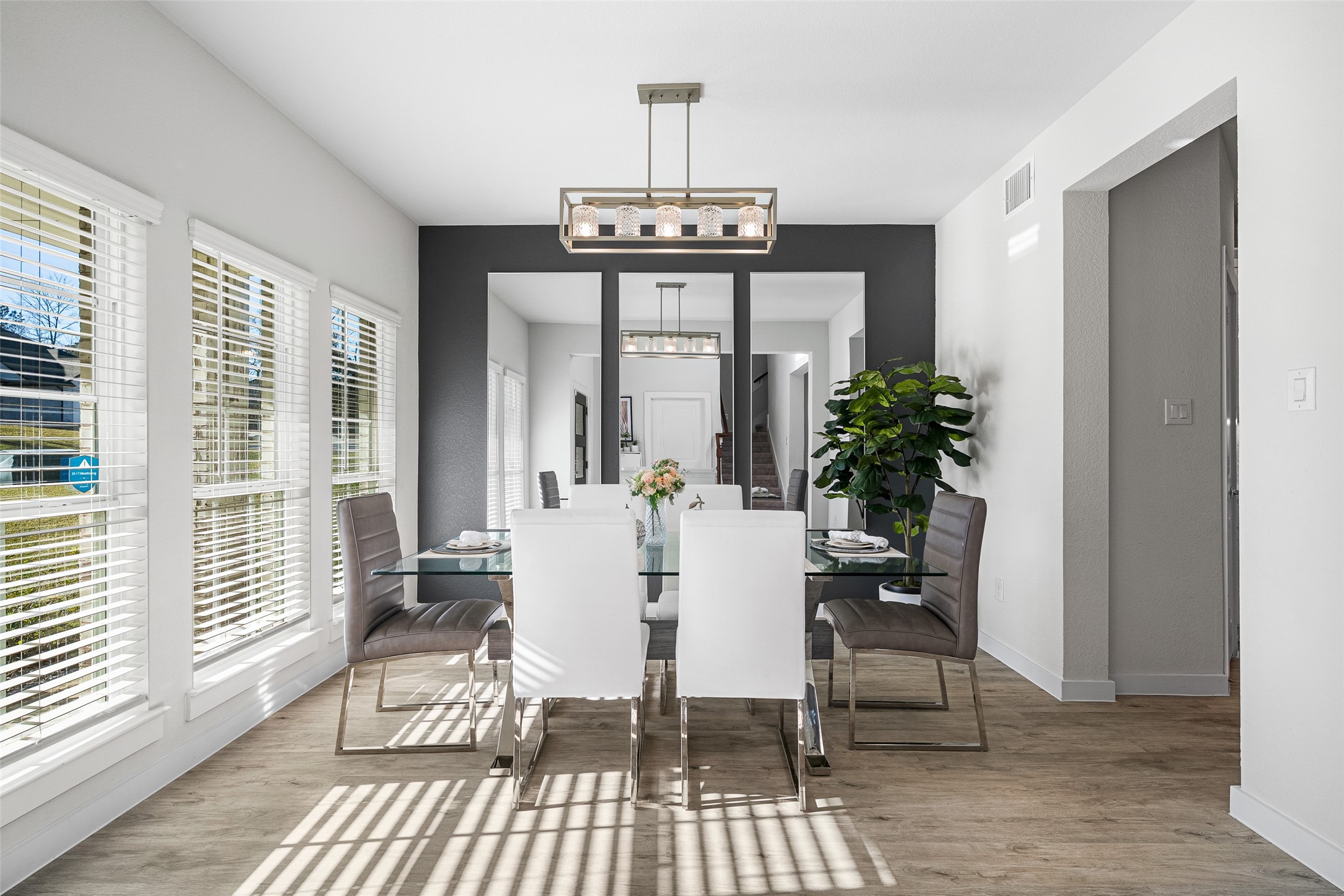 11731 Oakwood Rnch Drive Willis, TX 77378 - Photo 18 of 43 a view of a dining room with furniture window and wooden floor