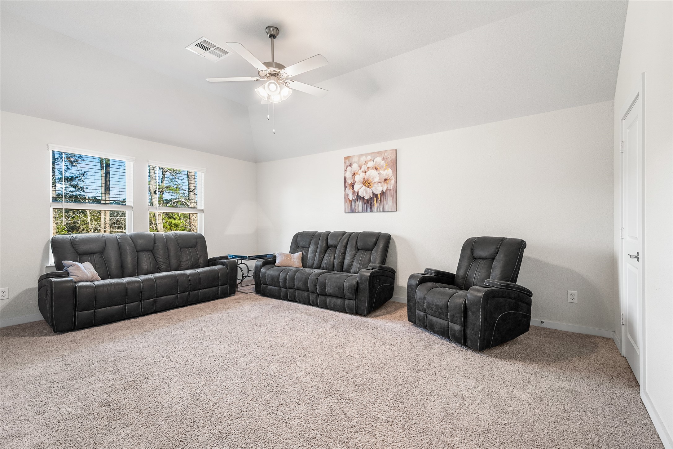 11731 Oakwood Rnch Drive Willis, TX 77378 - Photo 26 of 43 a living room with furniture and a ceiling fan