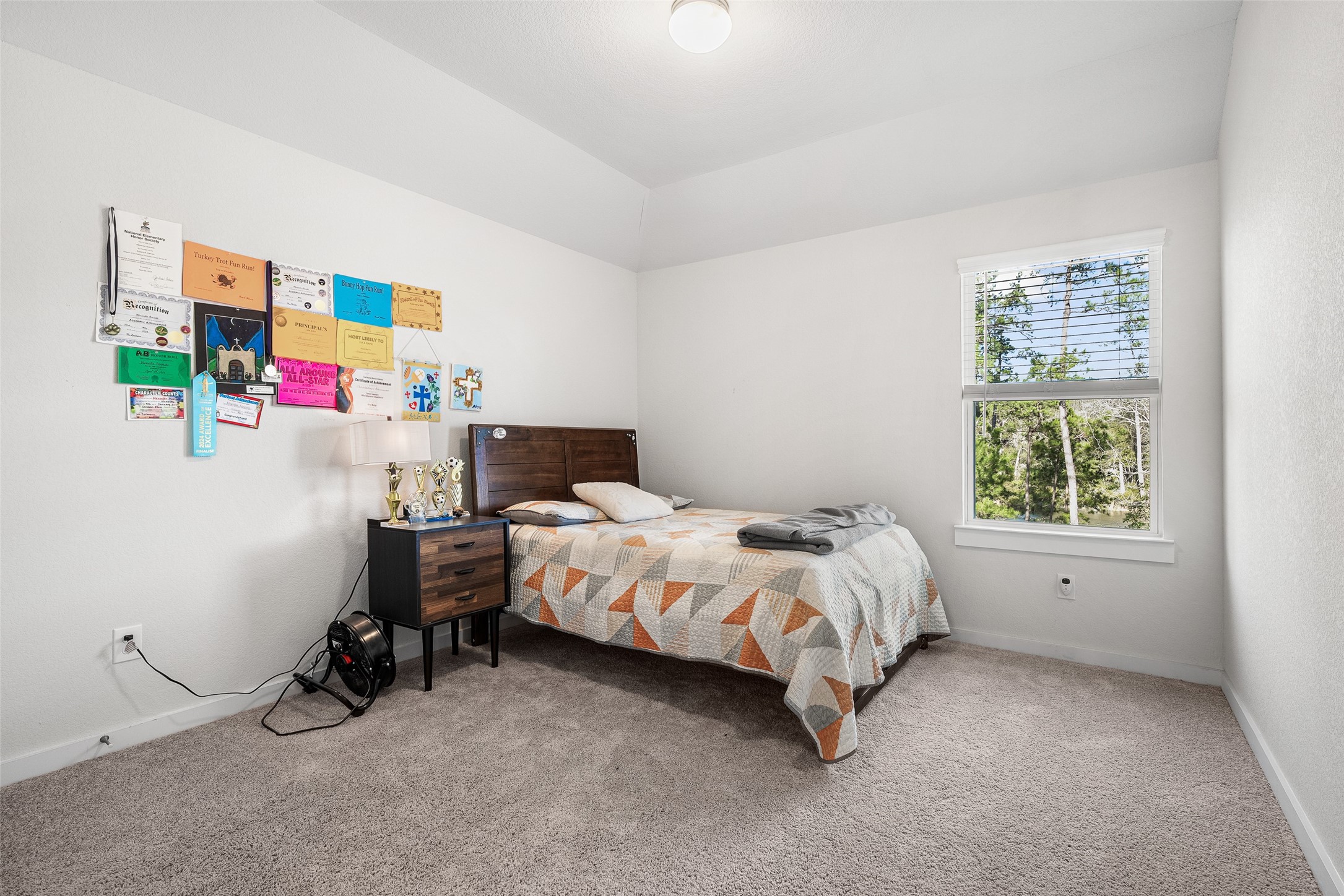 11731 Oakwood Rnch Drive Willis, TX 77378 - Photo 30 of 43 a bedroom with a bed and a window