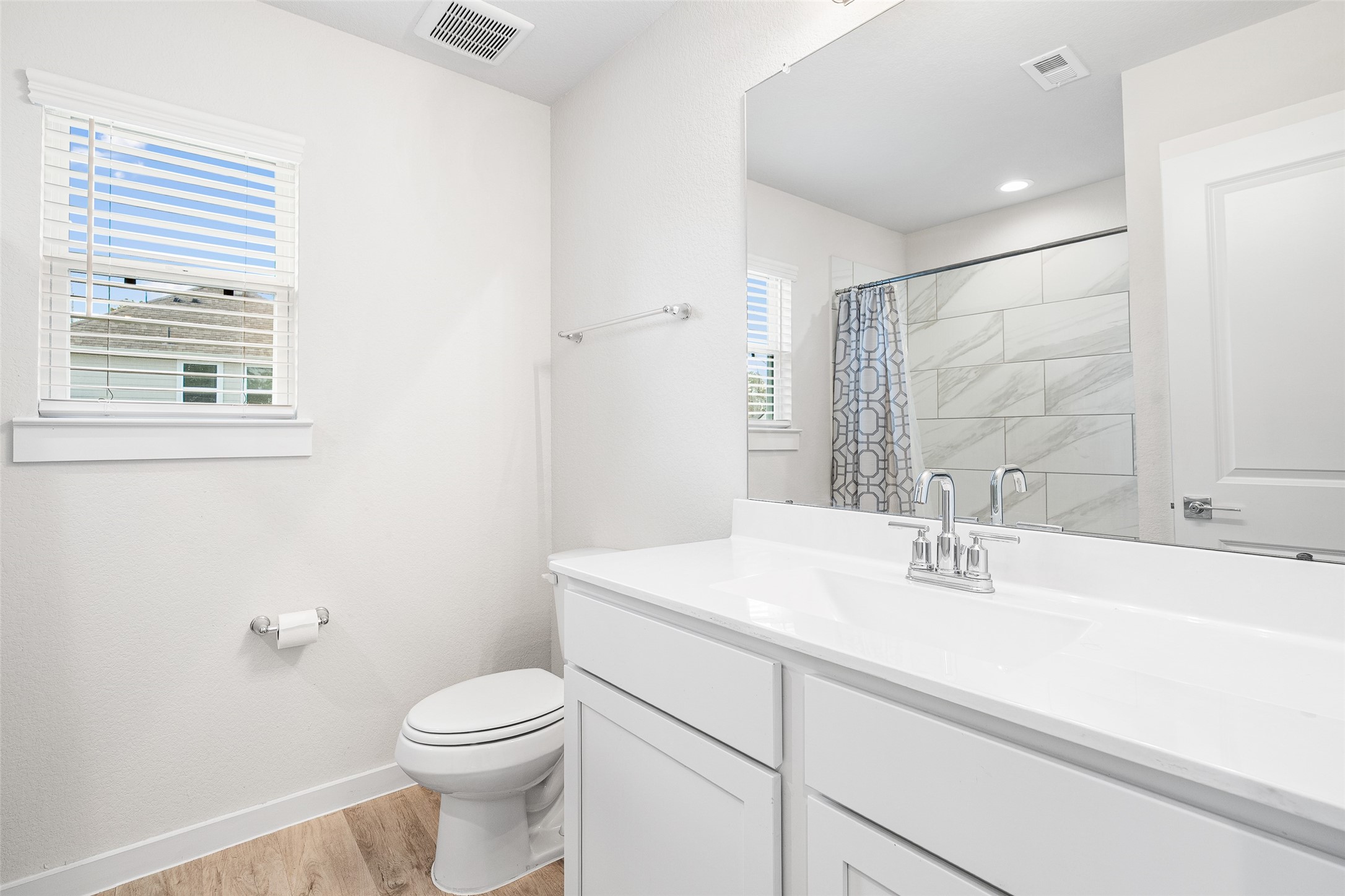 11731 Oakwood Rnch Drive Willis, TX 77378 - Photo 32 of 43 a bathroom with a sink a toilet and a mirror