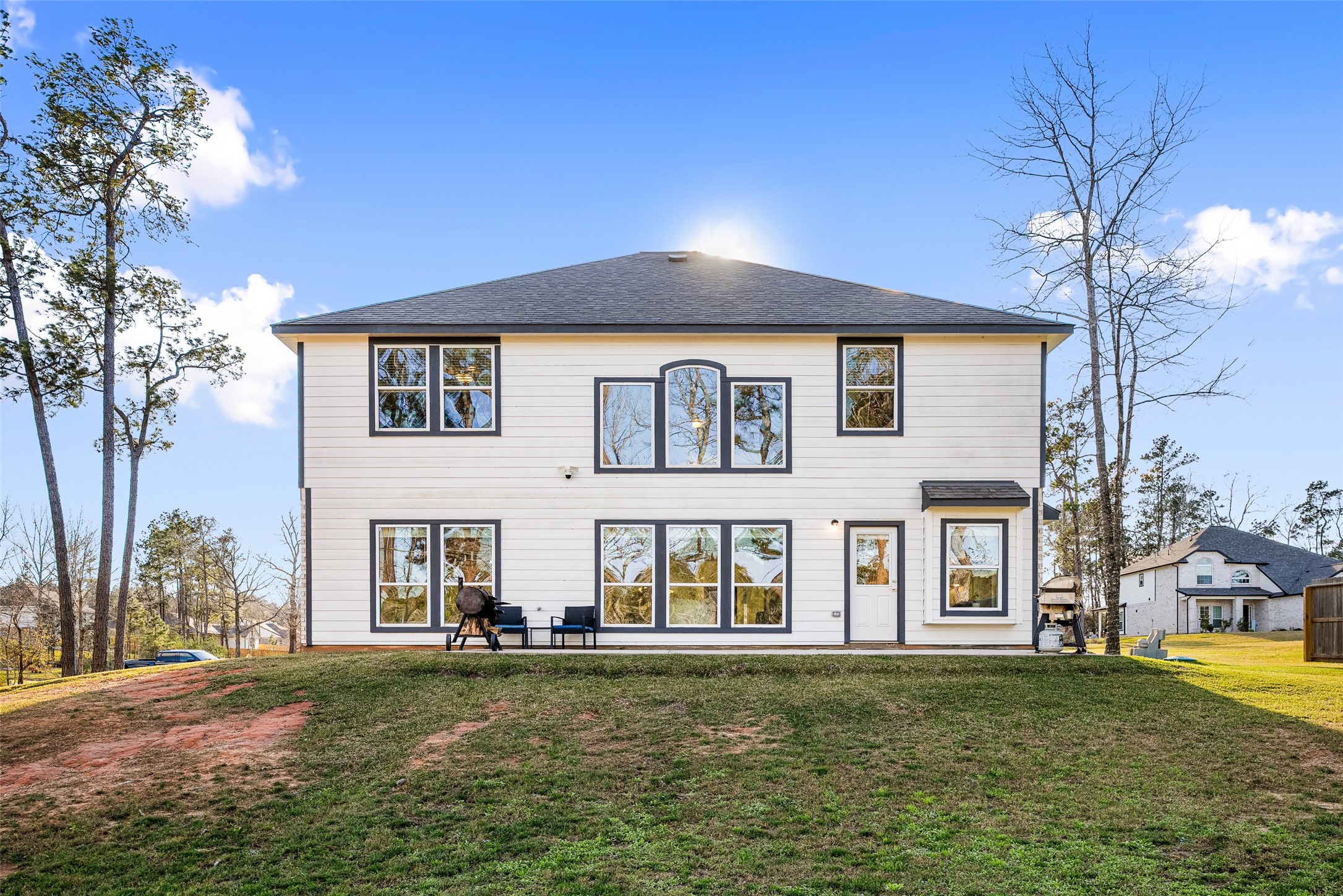 11731 Oakwood Rnch Drive Willis, TX 77378 - Photo 34 of 43 a front view of a house with a garden