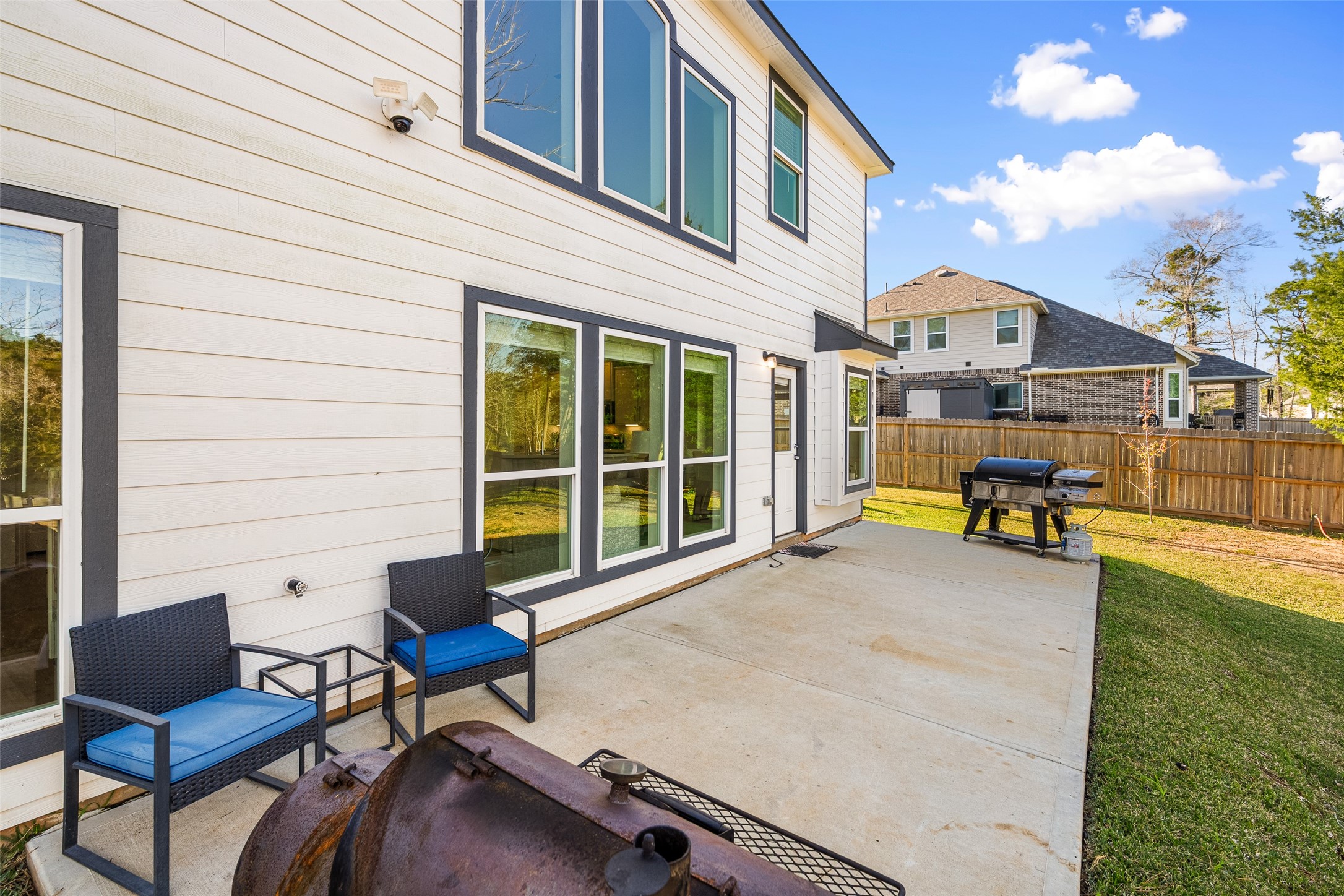 11731 Oakwood Rnch Drive Willis, TX 77378 - Photo 35 of 43 a view of a house with backyard and sitting area