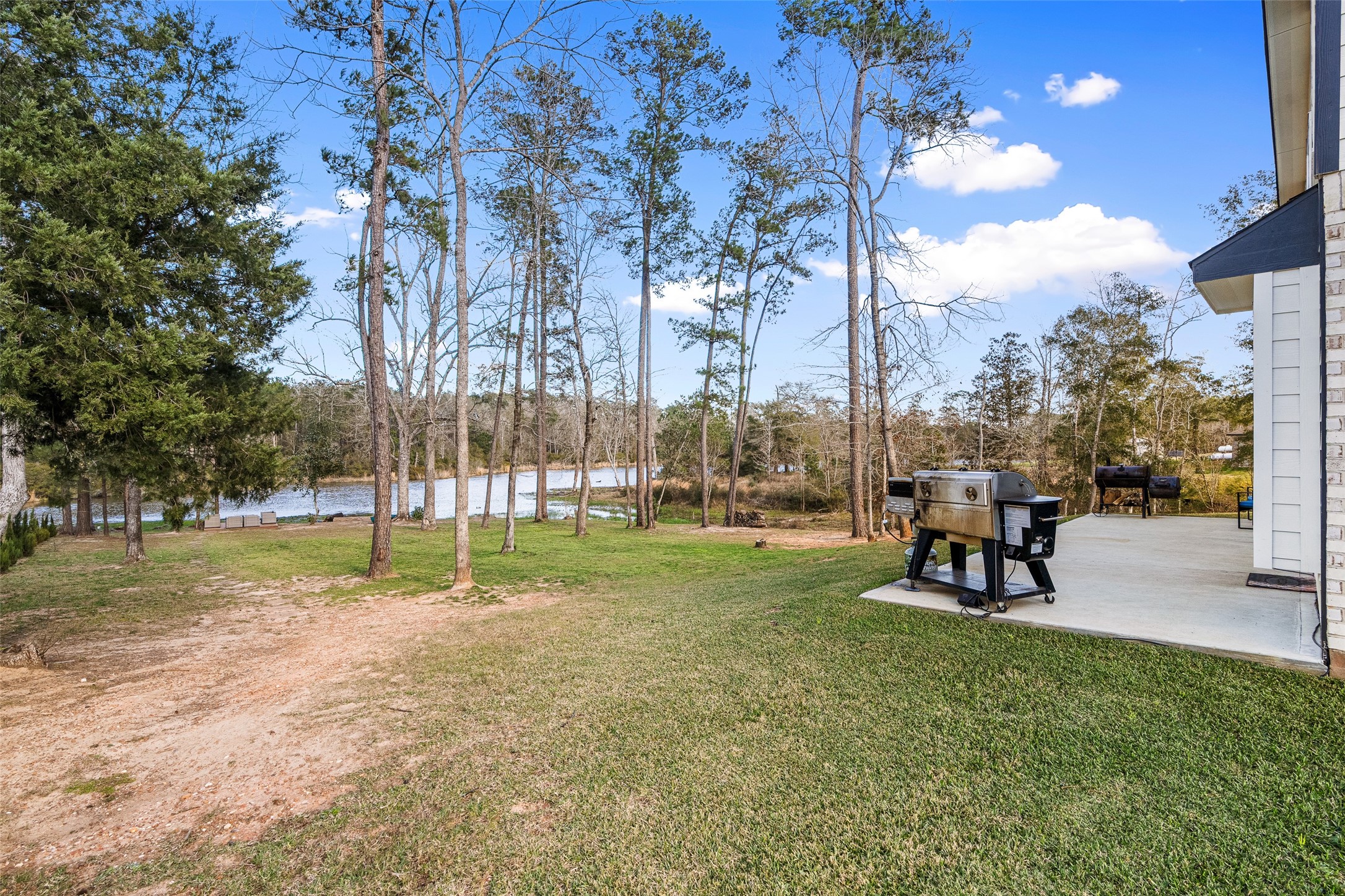 11731 Oakwood Rnch Drive Willis, TX 77378 - Photo 38 of 43 a view of a park with swings and slides