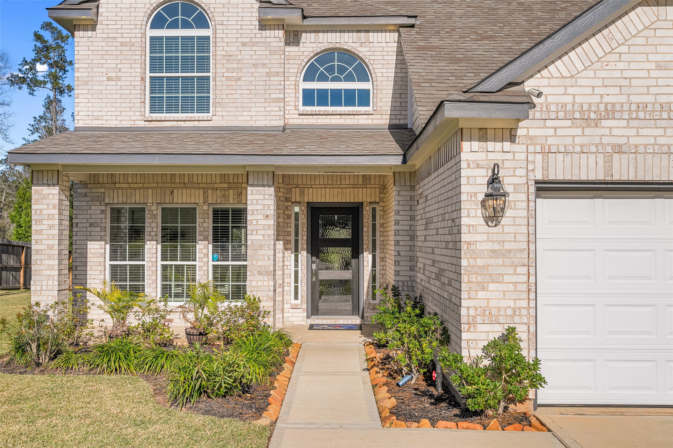 11731 Oakwood Rnch Drive Willis, TX 77378 - Photo 6 of 43 front view of a brick house