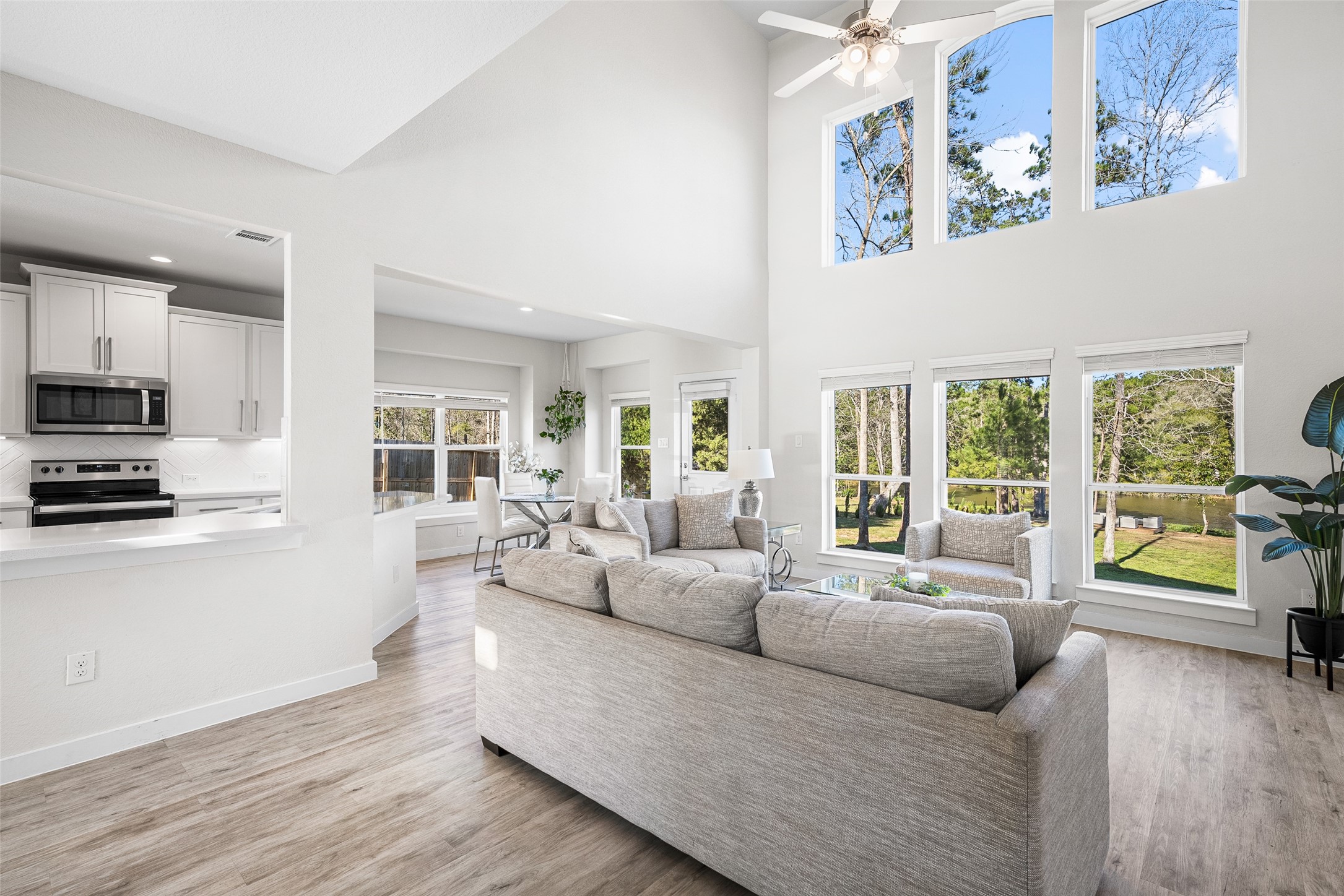 11731 Oakwood Rnch Drive Willis, TX 77378 - Photo 10 of 43 a living room with furniture and a large window