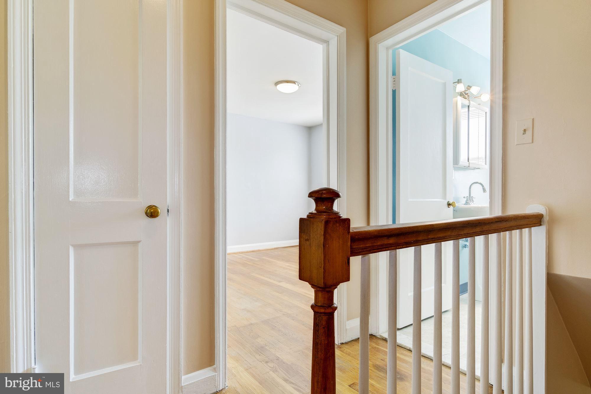 5902 Glenkirk Road Baltimore, MD 21239 - Photo 14 of 37 a view of a porch with wooden floor