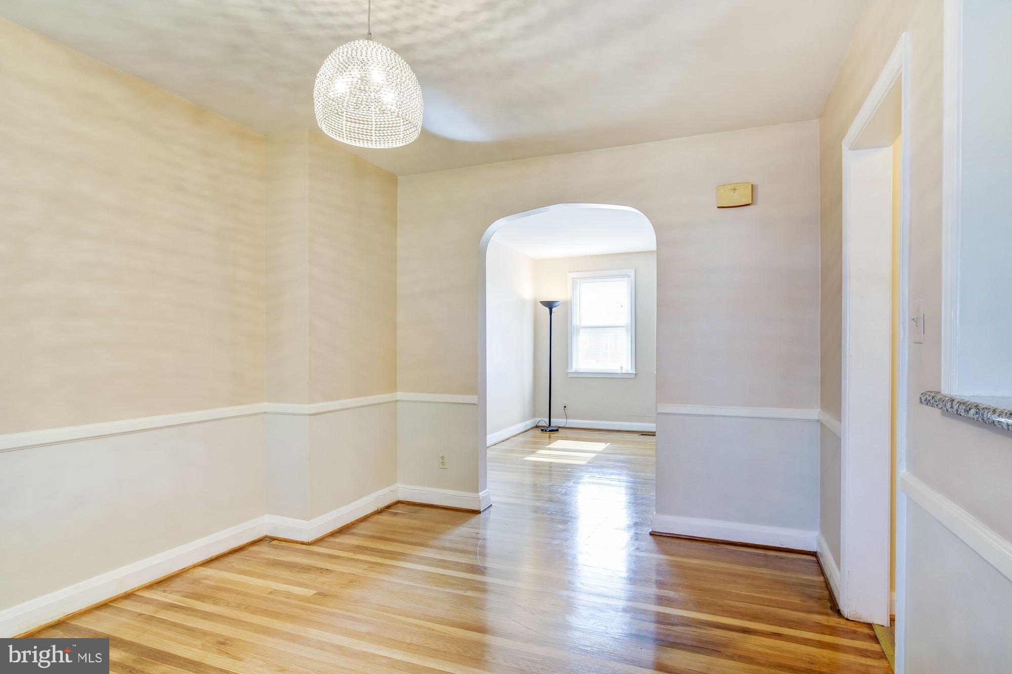 5902 Glenkirk Road Baltimore, MD 21239 - Photo 8 of 37 a view of empty room with wooden floor