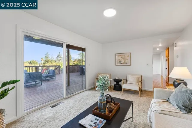 a living room with furniture and a table