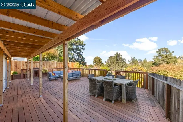 a view of a roof deck with patio