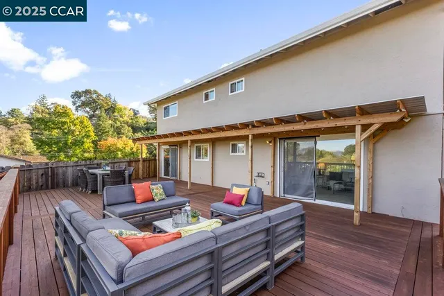 a outdoor living space with furniture and a potted plant