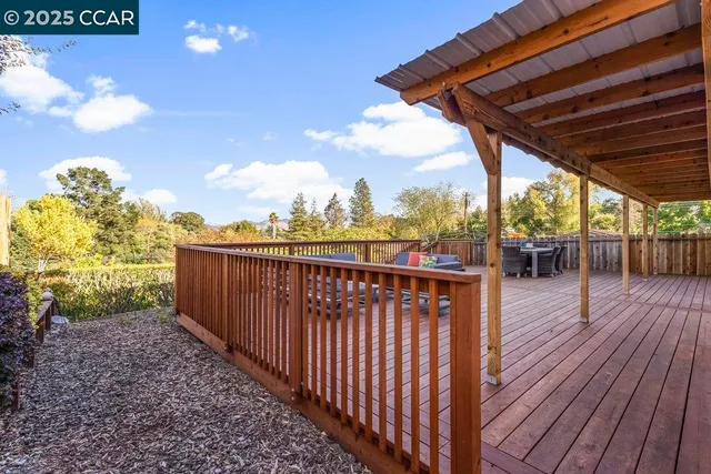 a view of a balcony with wooden floor