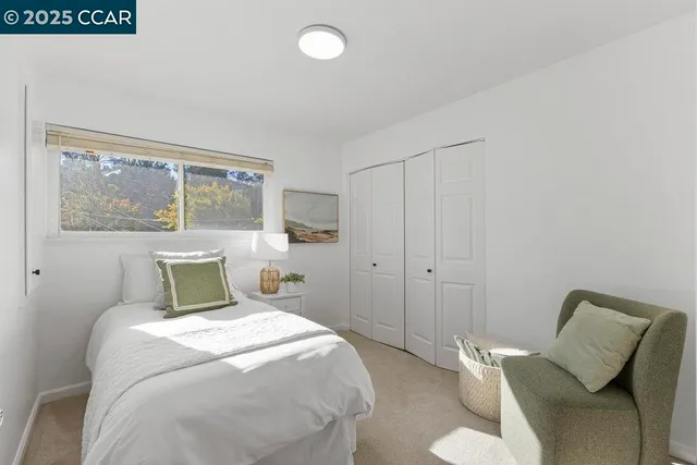 a bed room with a bed and a large window