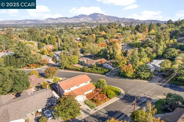 an aerial view of residential house with an outdoor space swimming pool