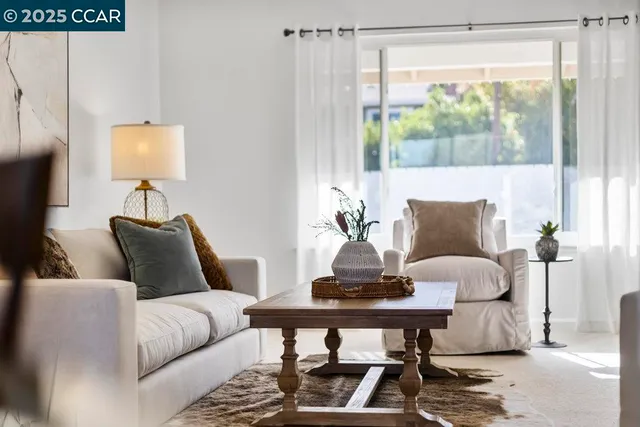 a living room with furniture and a window