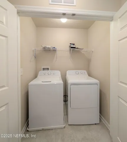 a utility room with dryer and washer