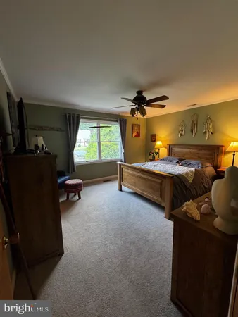 a bedroom with bed and window