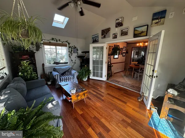 a living room with furniture gym equipment and a fireplace