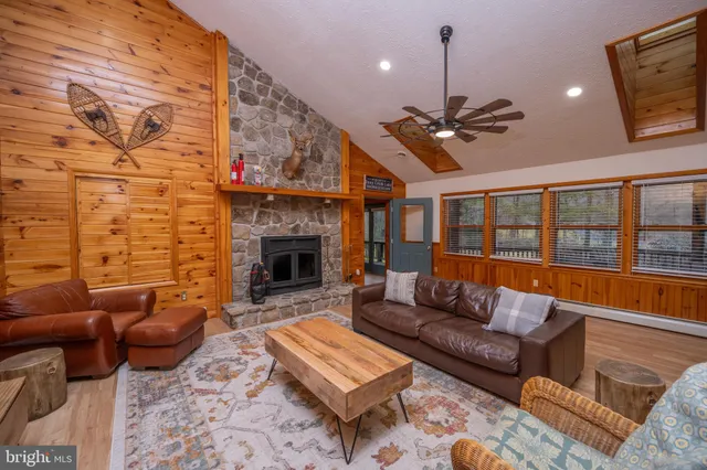 a bedroom with furniture and a flat screen tv