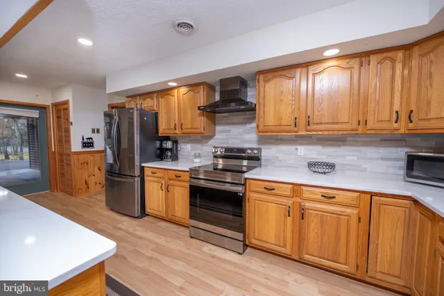 a living room with furniture fireplace and flat screen tv