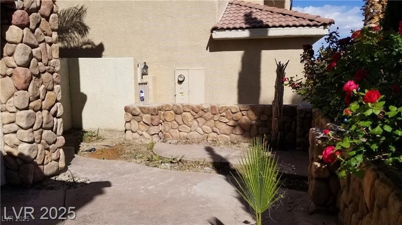 7414 Page Ranch Court Las Vegas, NV 89131 - Photo 16 of 36 View of side of property featuring stucco siding