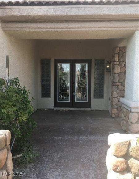 7414 Page Ranch Court Las Vegas, NV 89131 - Photo 2 of 36 Entrance to property with french doors and stucco siding