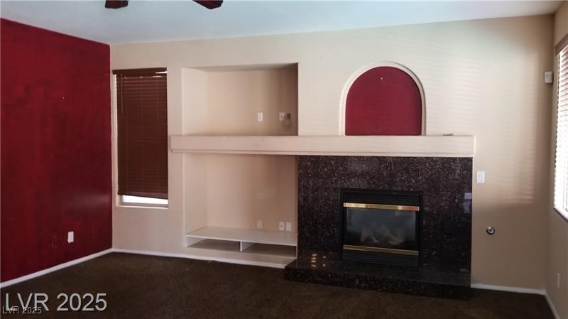 7414 Page Ranch Court Las Vegas, NV 89131 - Photo 23 of 36 Detailed view of a fireplace, carpet floors, and ceiling fan